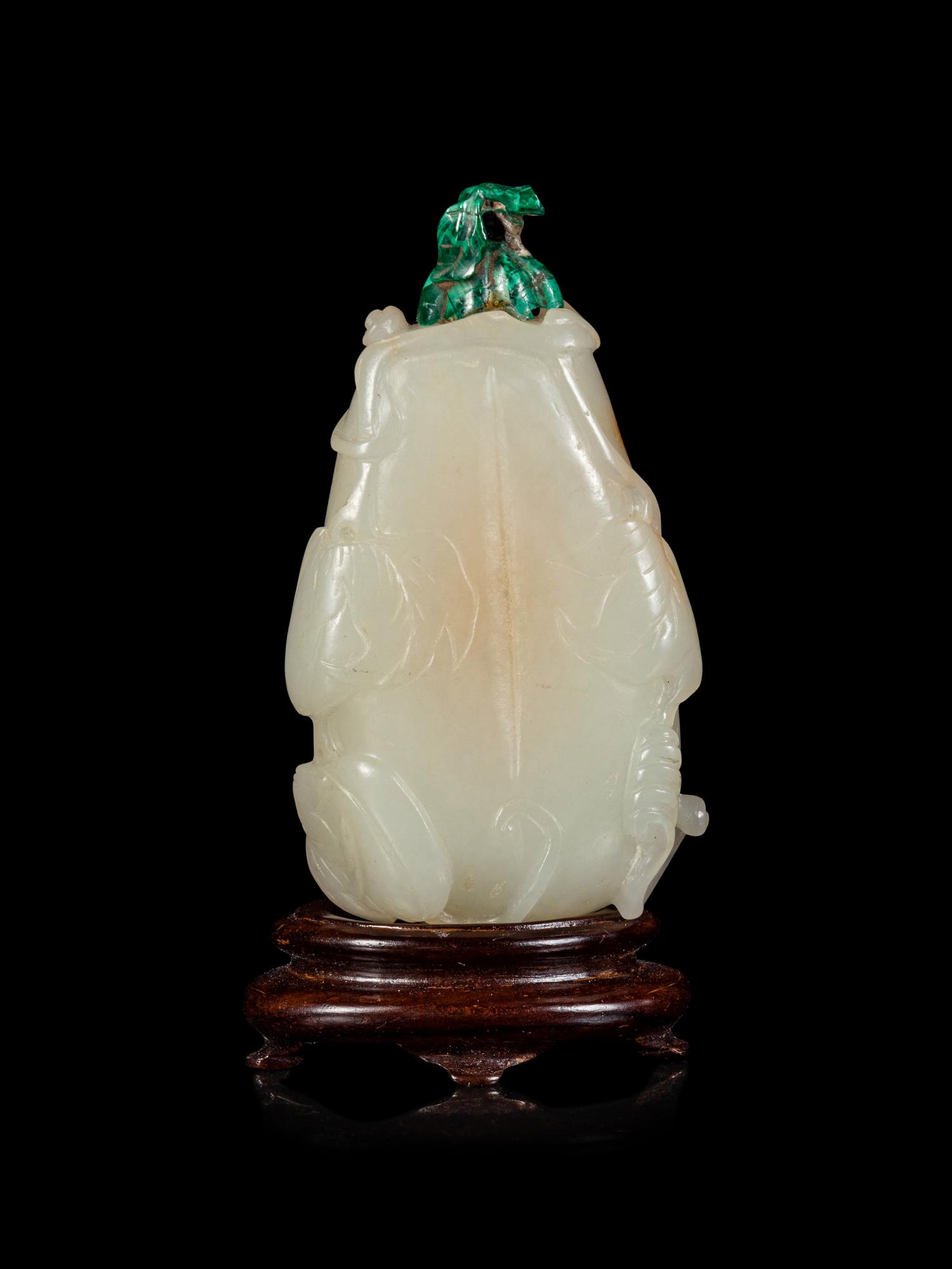 A Russet and White Jade 'Butterfly and Melon' Snuff Bottle