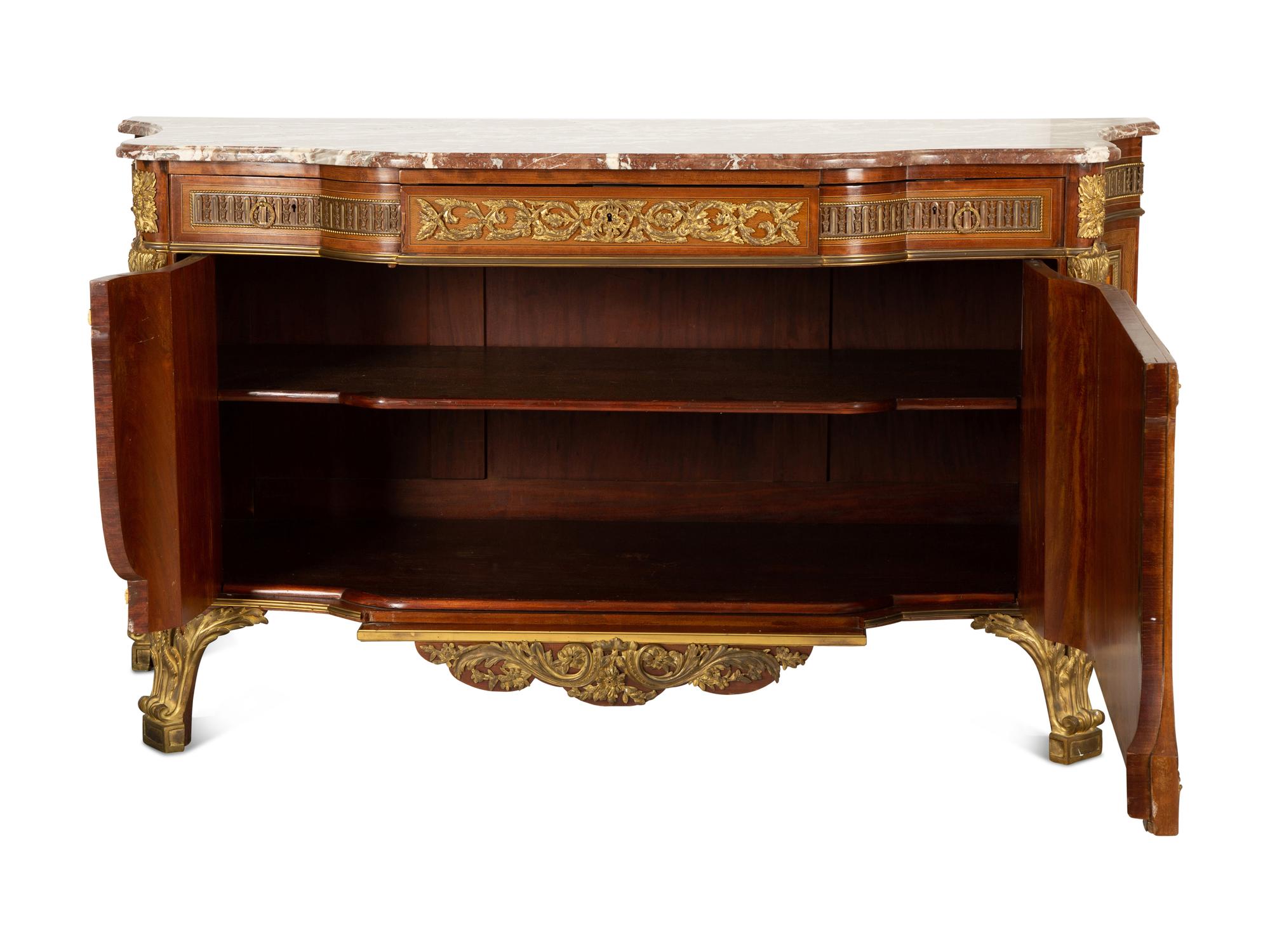 A Louis XVI Style Gilt Bronze Mounted Kingwood and Marquetry Marble-Top Commode