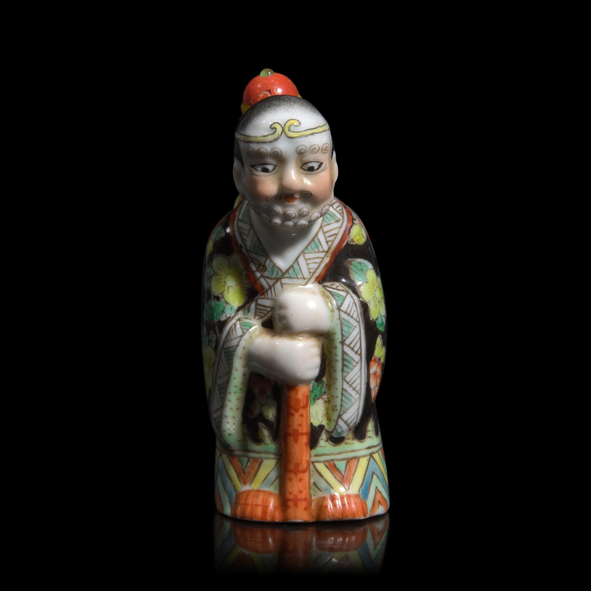 A Chinese Enameled Molded Porcelain Figural Snuff Bottle, Late 19th century