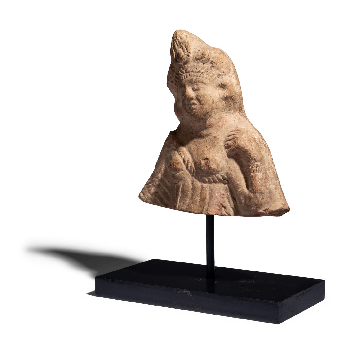 An Egyptian Terracotta Bust of Isis