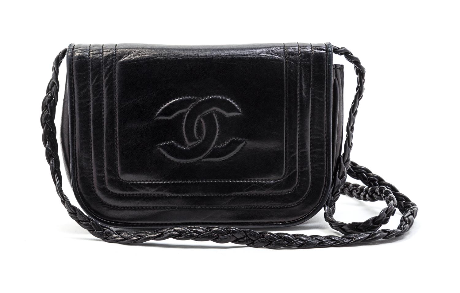 A Chanel Black Leather Flap Bag, 7 x 4 1/2 x 1 1/2 inches.