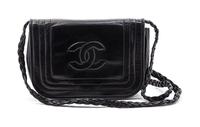 A Chanel Black Leather Flap Bag, 7 x 4 1/2 x 1 1/2 inches.