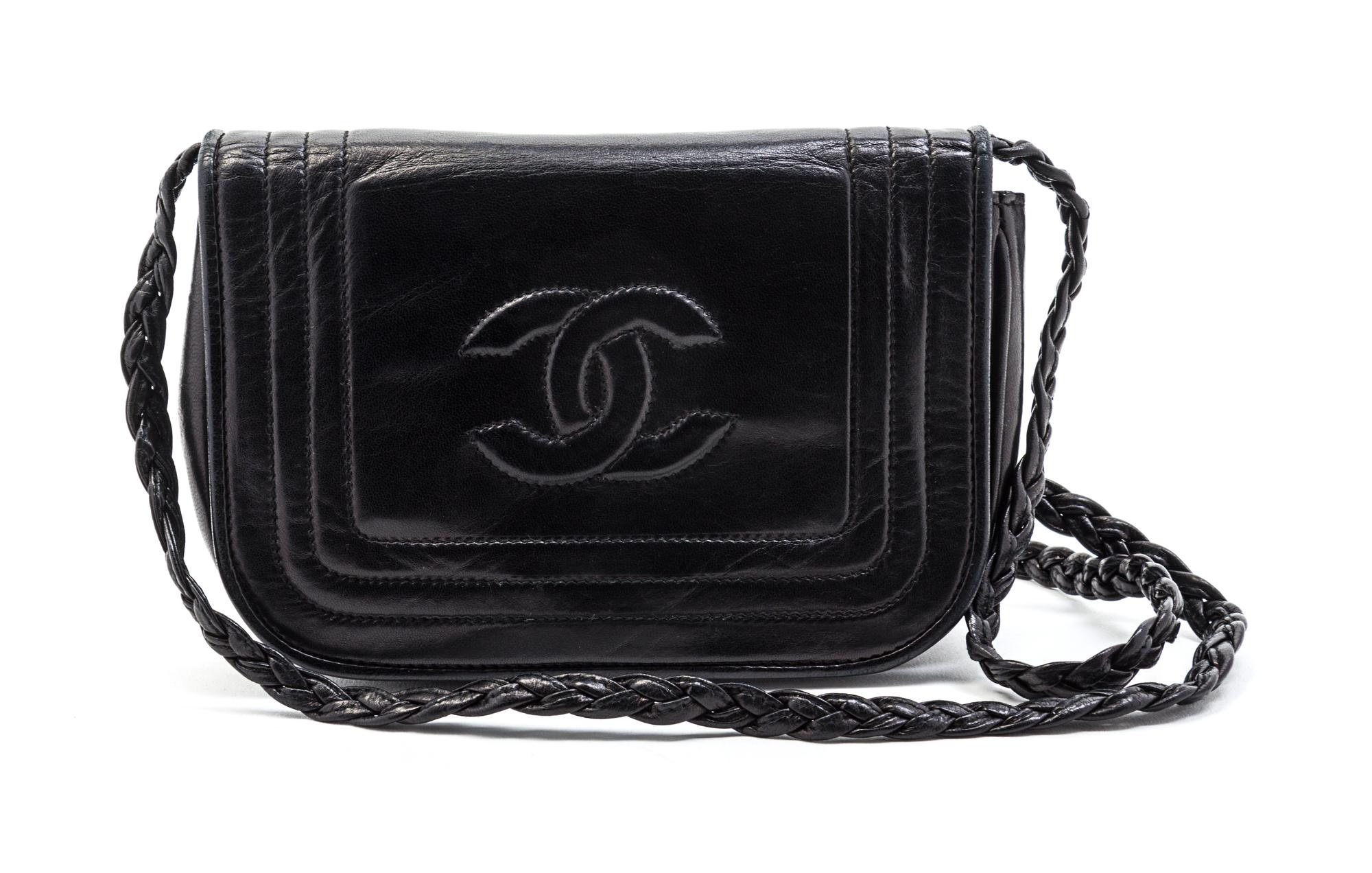 A Chanel Black Leather Flap Bag, 7 x 4 1/2 x 1 1/2 inches.