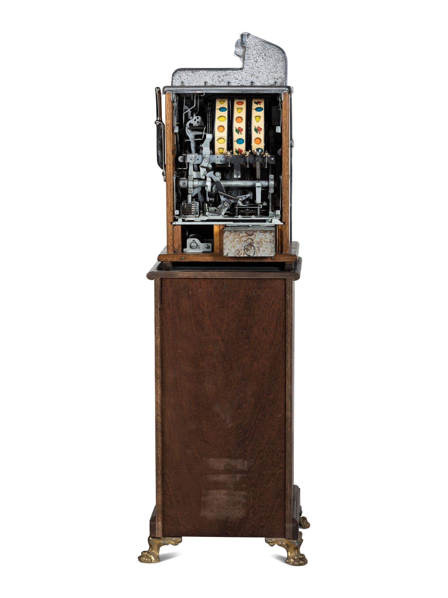 A Mills Novelty Co. Castle Front 50 Cent Slot Machine on Chief's Head Engraved Glass Stand