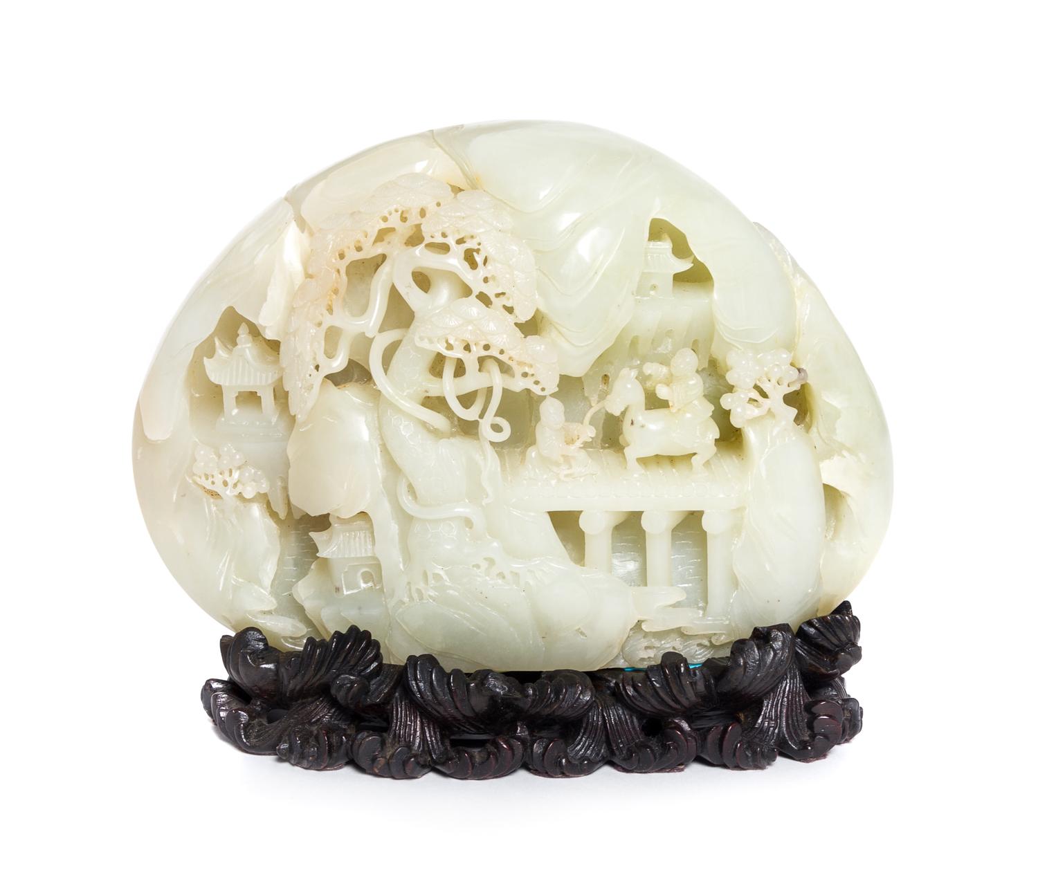 A Carved Pale Celadon Jade Boulder Height 7 x width 8 inches.