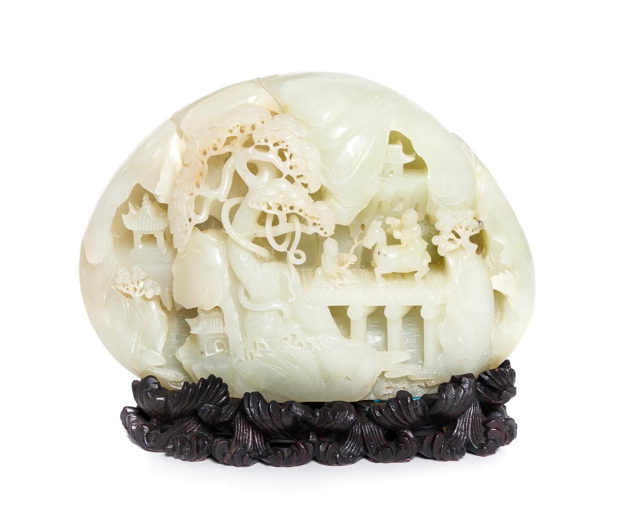 A Carved Pale Celadon Jade Boulder Height 7 x width 8 inches.