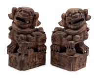 A Pair of Carved Wood Buddhistic Lions