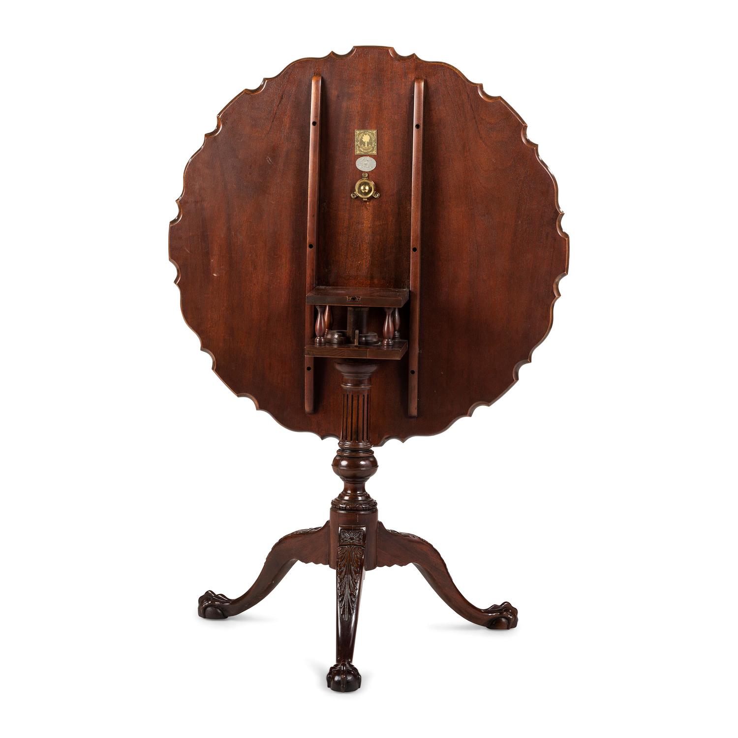 A Chippendale Style Carved Mahogany Pie-Crust Tilt-Top Tea Table