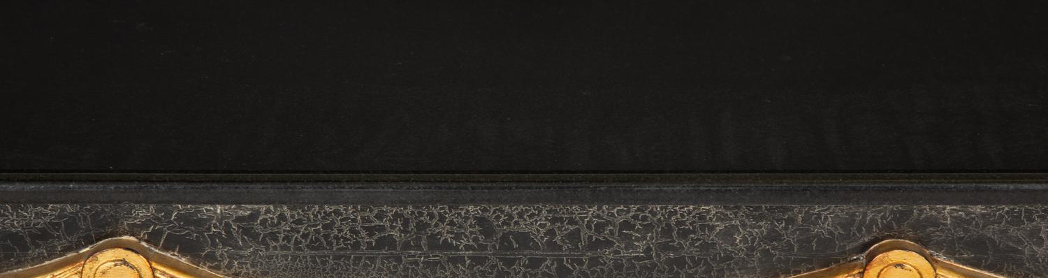 An Ebonized Console Table with Granite Top and Gilt Swag Motif