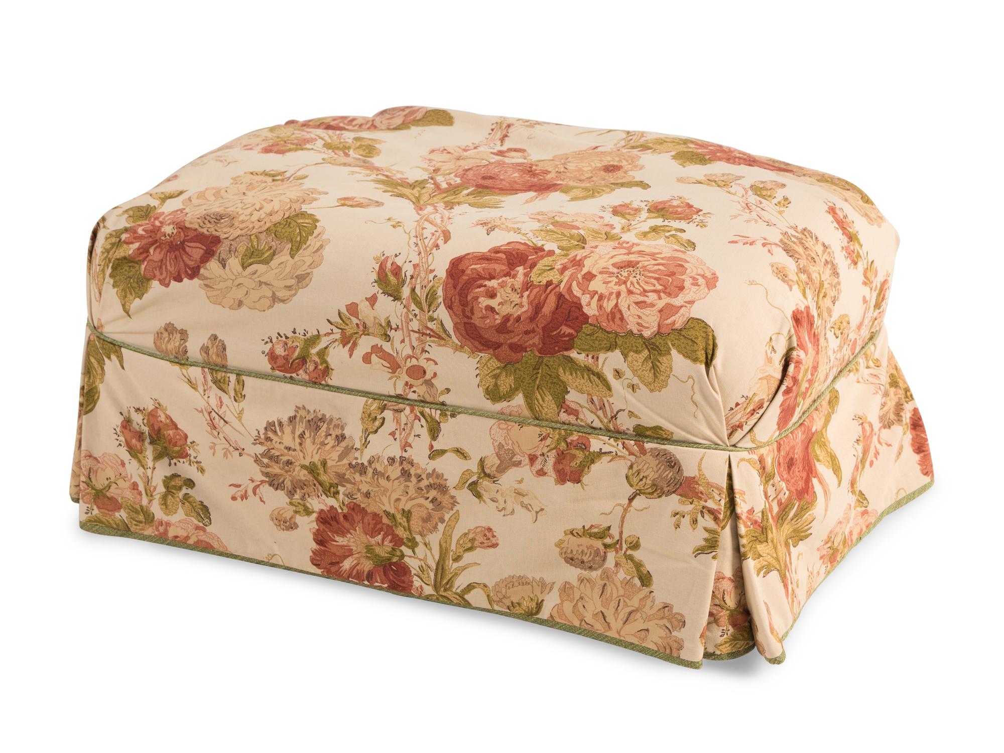 Two Chintz Slip-Covered Armchairs and an Ottoman