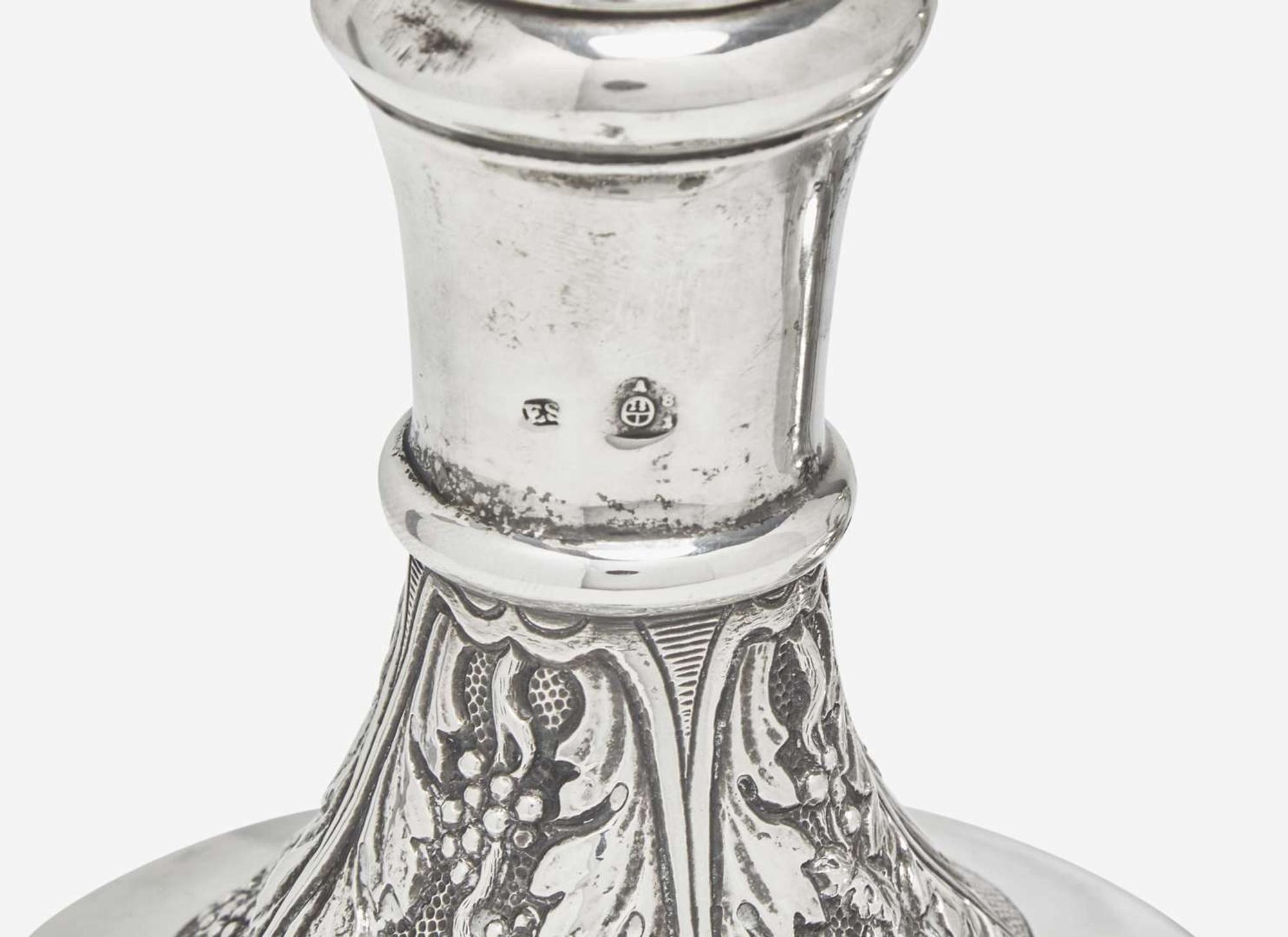 A Continental repoussé silver carafe and a sterling silver teapot, the teapot by Tiffany & Co., New York, NY, 1873-1891