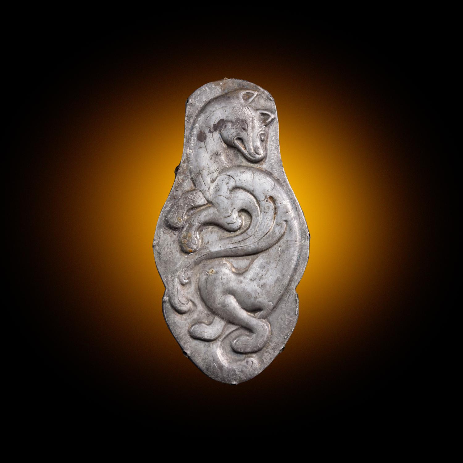 A Chinese Silver 'Winged Fox' Harness Ornament, Northeast China, Xianbei Tribe, Han-Jin Dynasty 汉-晉 鲜卑“飛狐”銀馬珂