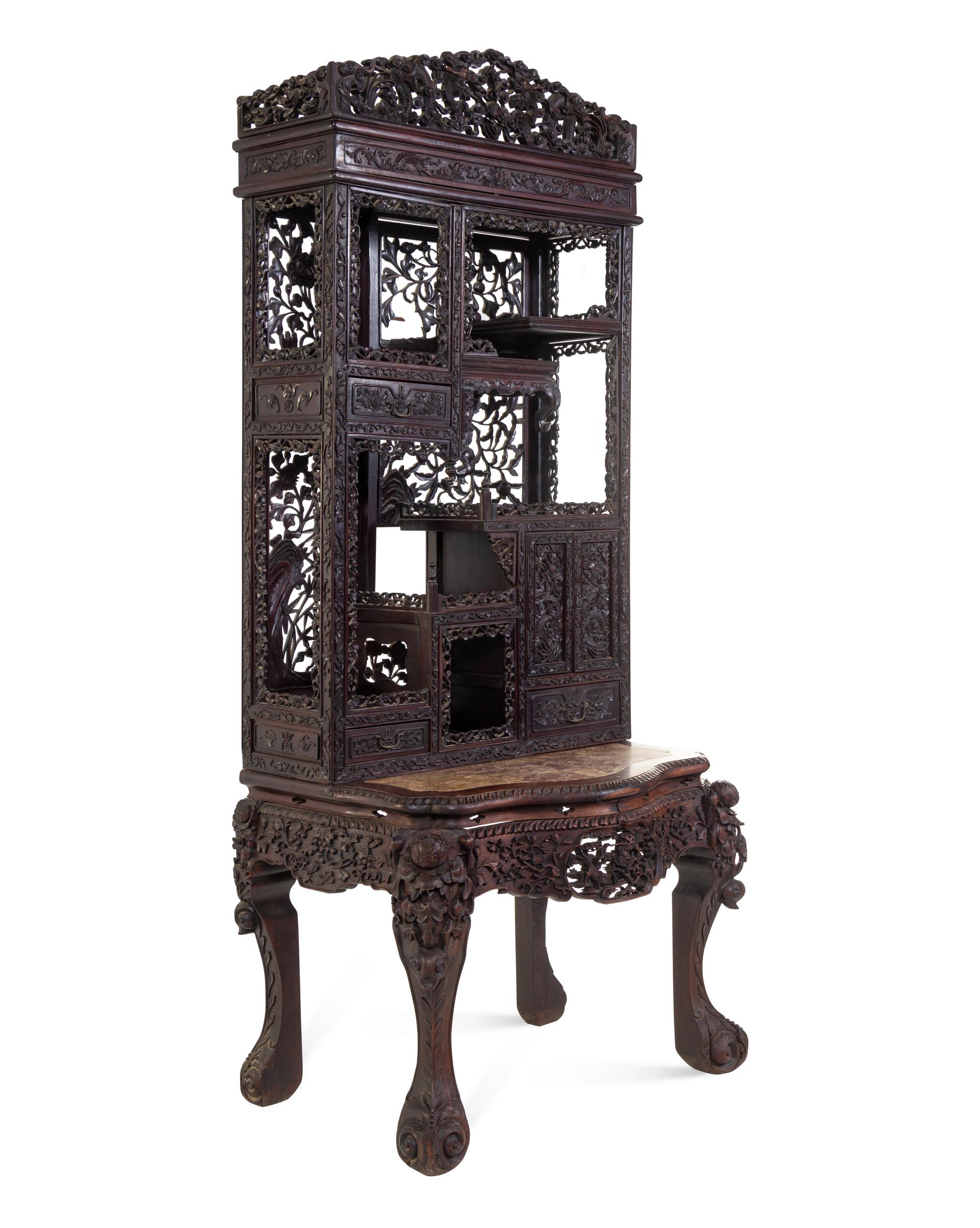 A Chinese Export Carved Hardwood Displaying Cabinet and Desk