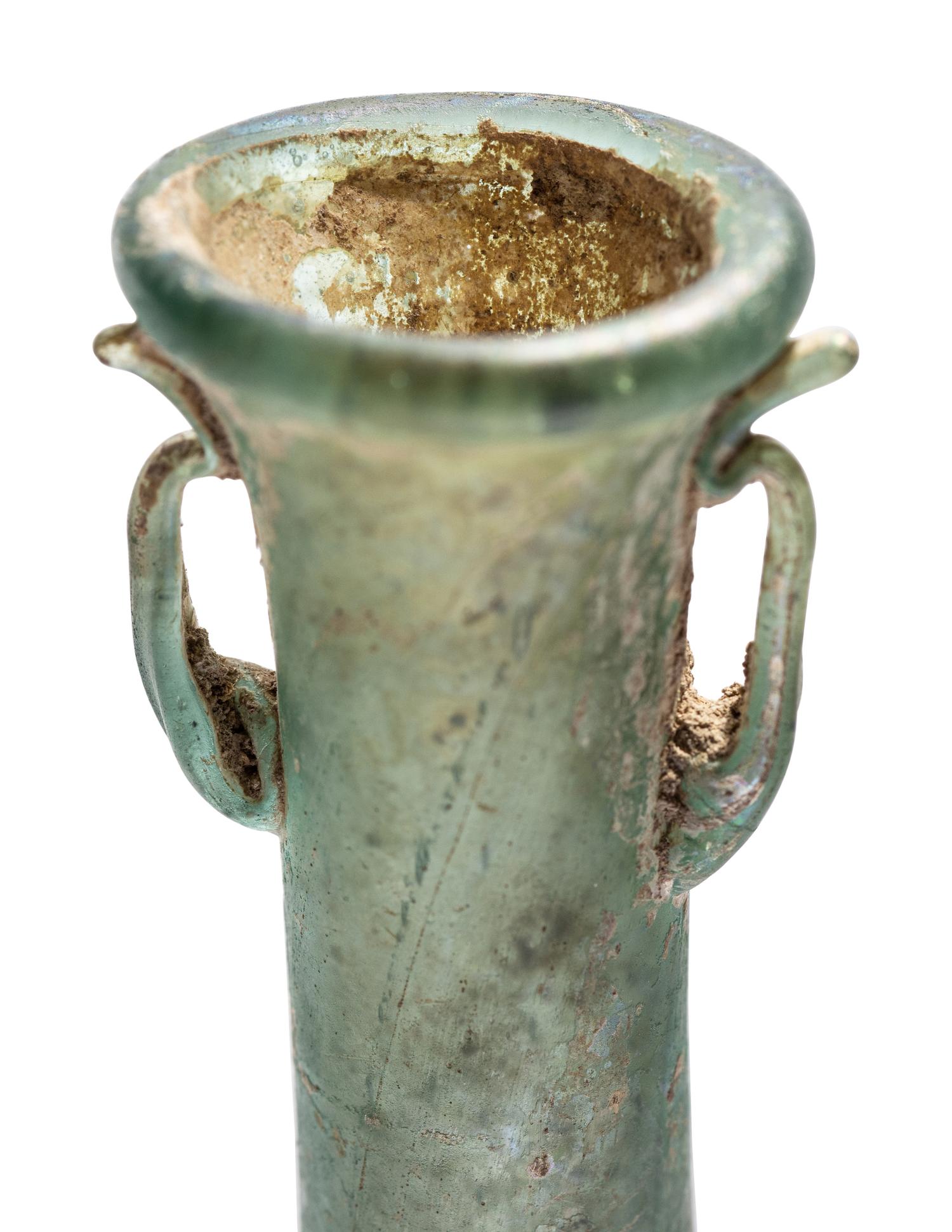 A Roman Blue Glass Unguentarium