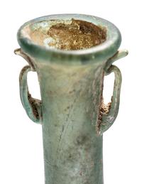A Roman Blue Glass Unguentarium