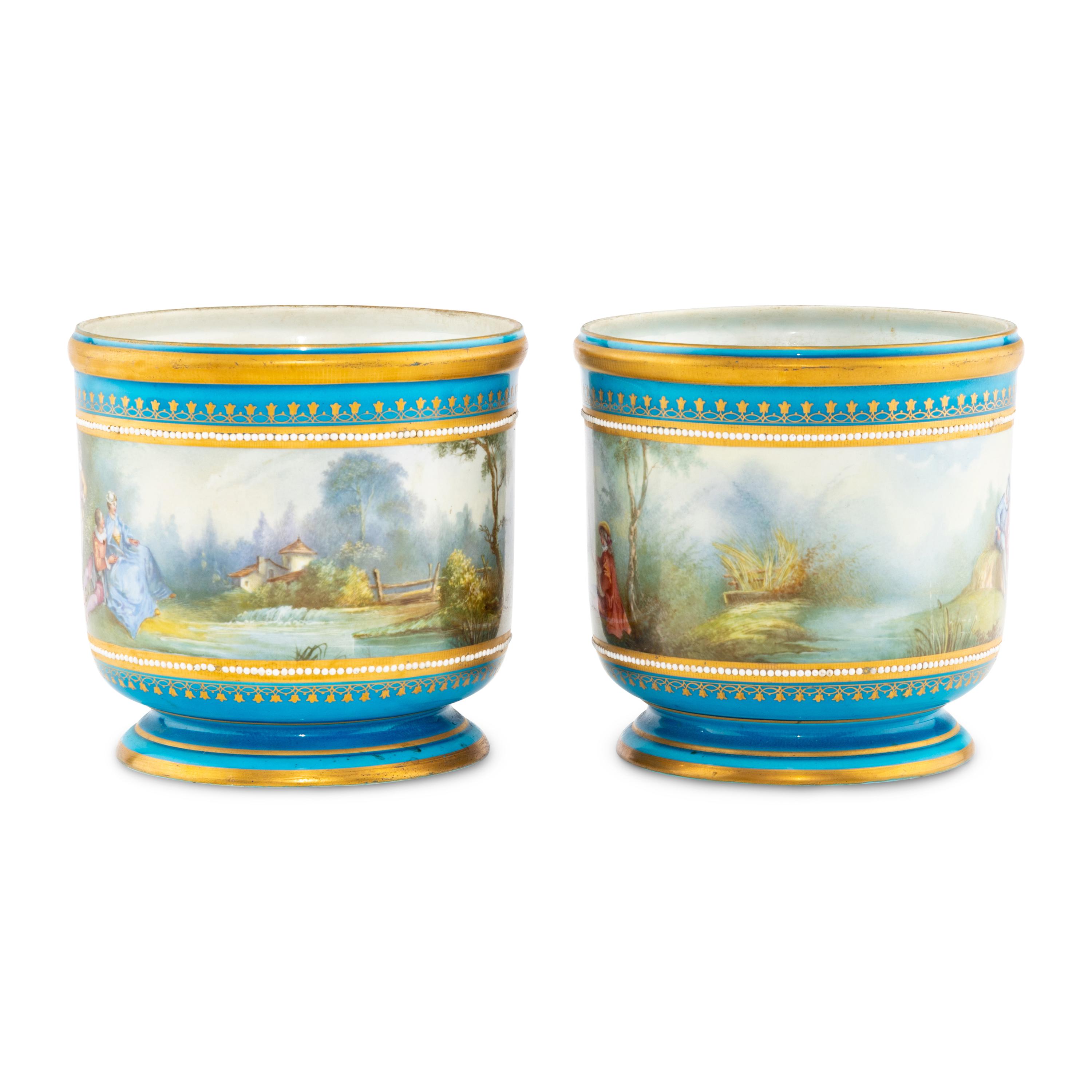 A Pair of Sèvres Style Porcelain Cache Pots