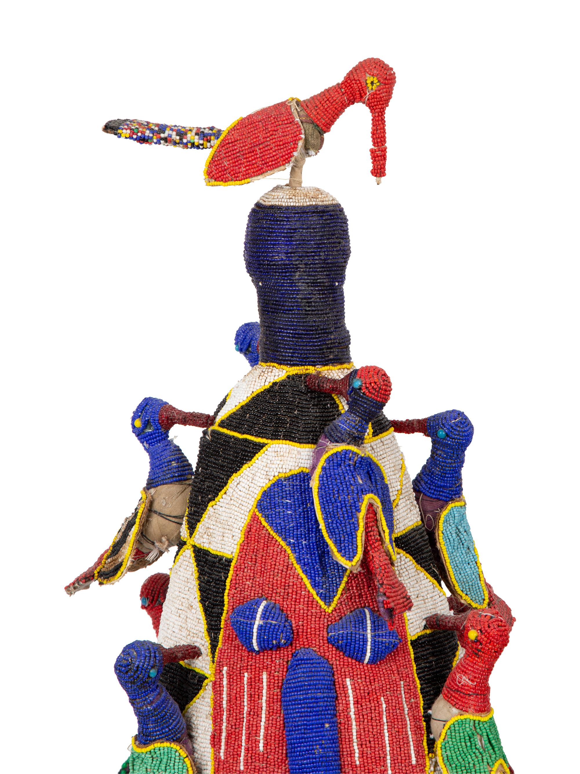 A Group of Three Yoruba Beaded Headdresses and Two Talisman Panels — 20TH CENTURY