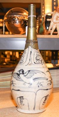 A Vietnamese Ceramic and Bronze Vessel, , having a bronze tapering spout surmounting a ceramic body with white ground and painted blue