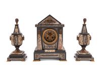 An Egyptian Revival Marble and Patinated Bronze Mantel Clock Garniture