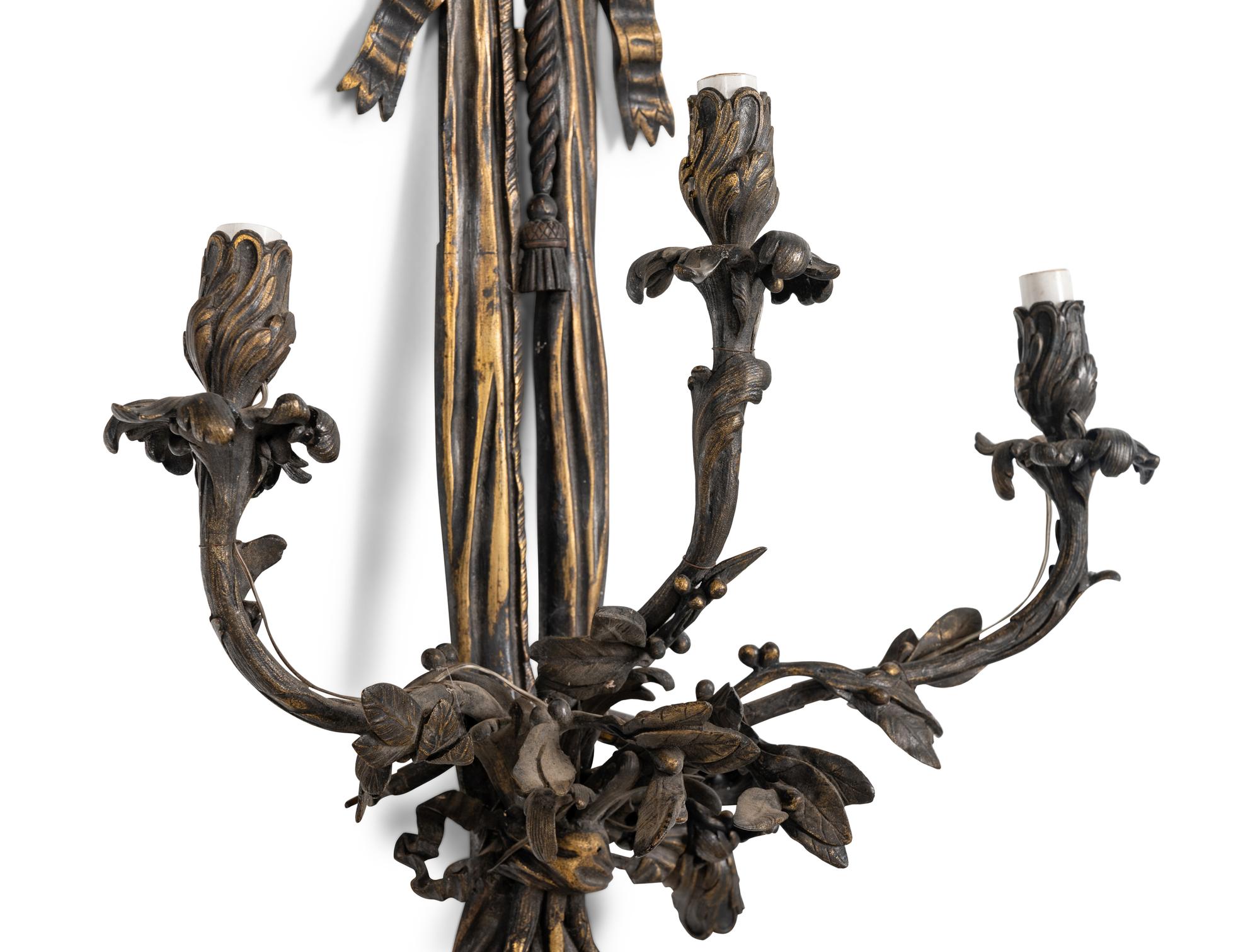 A Pair of Large Louis XVI Style Bronze Seven-Light Sconces