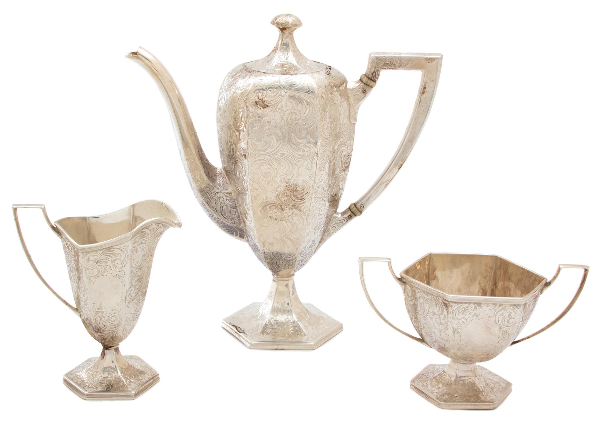 An American Silver Three-Piece Coffee Service, Lebkuecher & Co., Newark, NJ, comprising a coffee pot, open sugar and creamer with overa