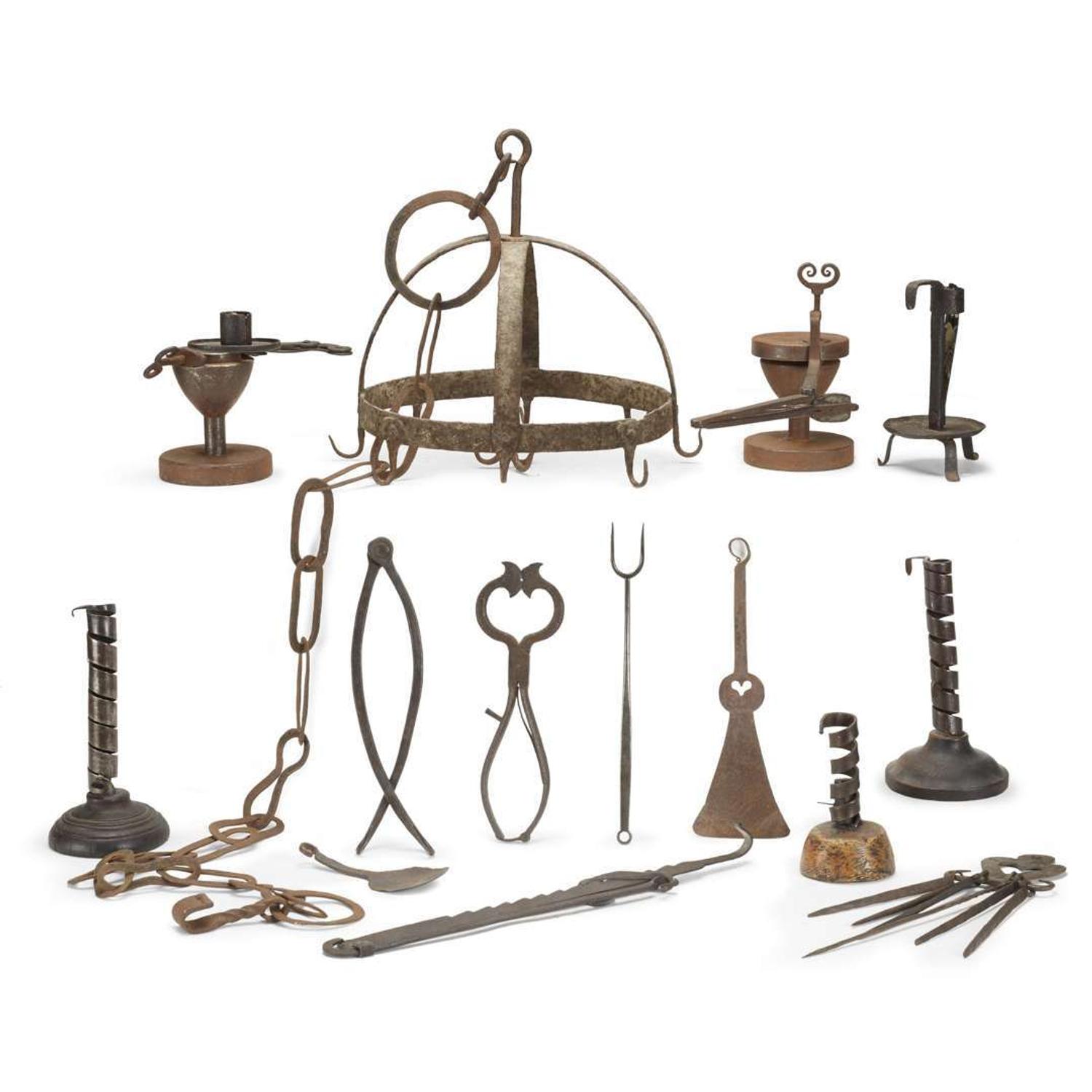 Large group of thirty-four iron, wood, brass, and copper lighting devices and cooking implements 18th/19th century