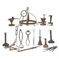 Large group of thirty-four iron, wood, brass, and copper lighting devices and cooking implements 18th/19th century