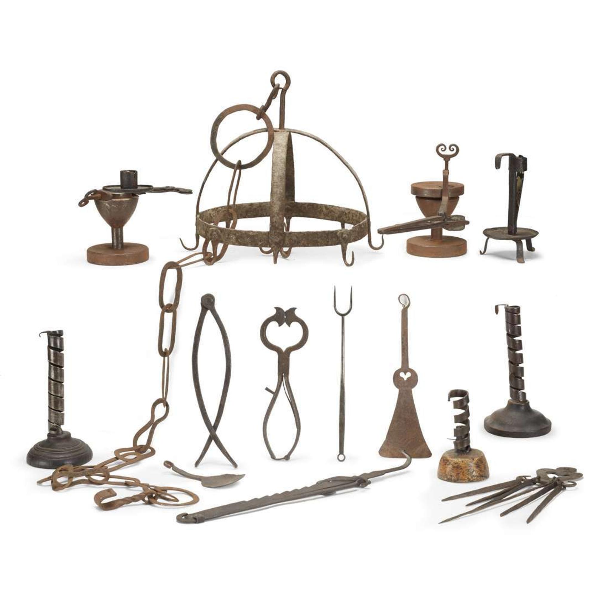 Large group of thirty-four iron, wood, brass, and copper lighting devices and cooking implements 18th/19th century