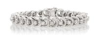 A White Gold and Diamond Line Bracelet, 22.40 dwts.