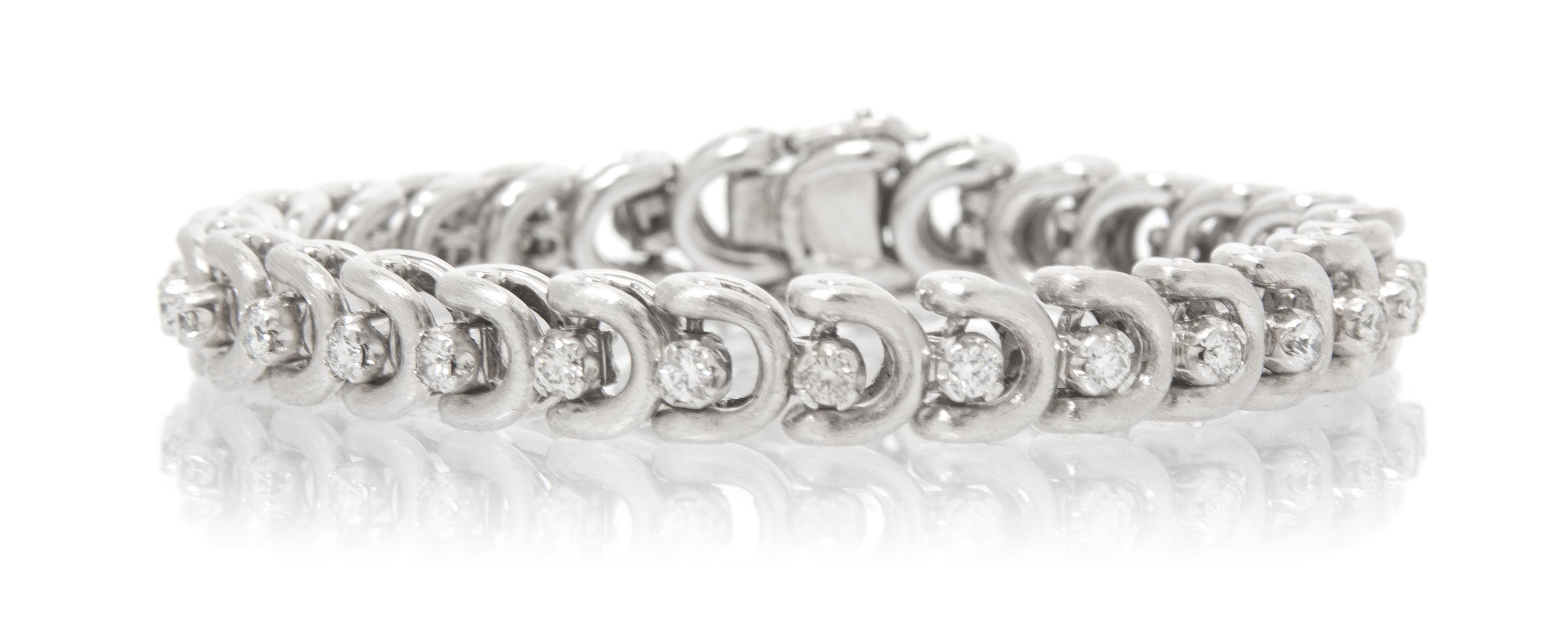 A White Gold and Diamond Line Bracelet, 22.40 dwts.