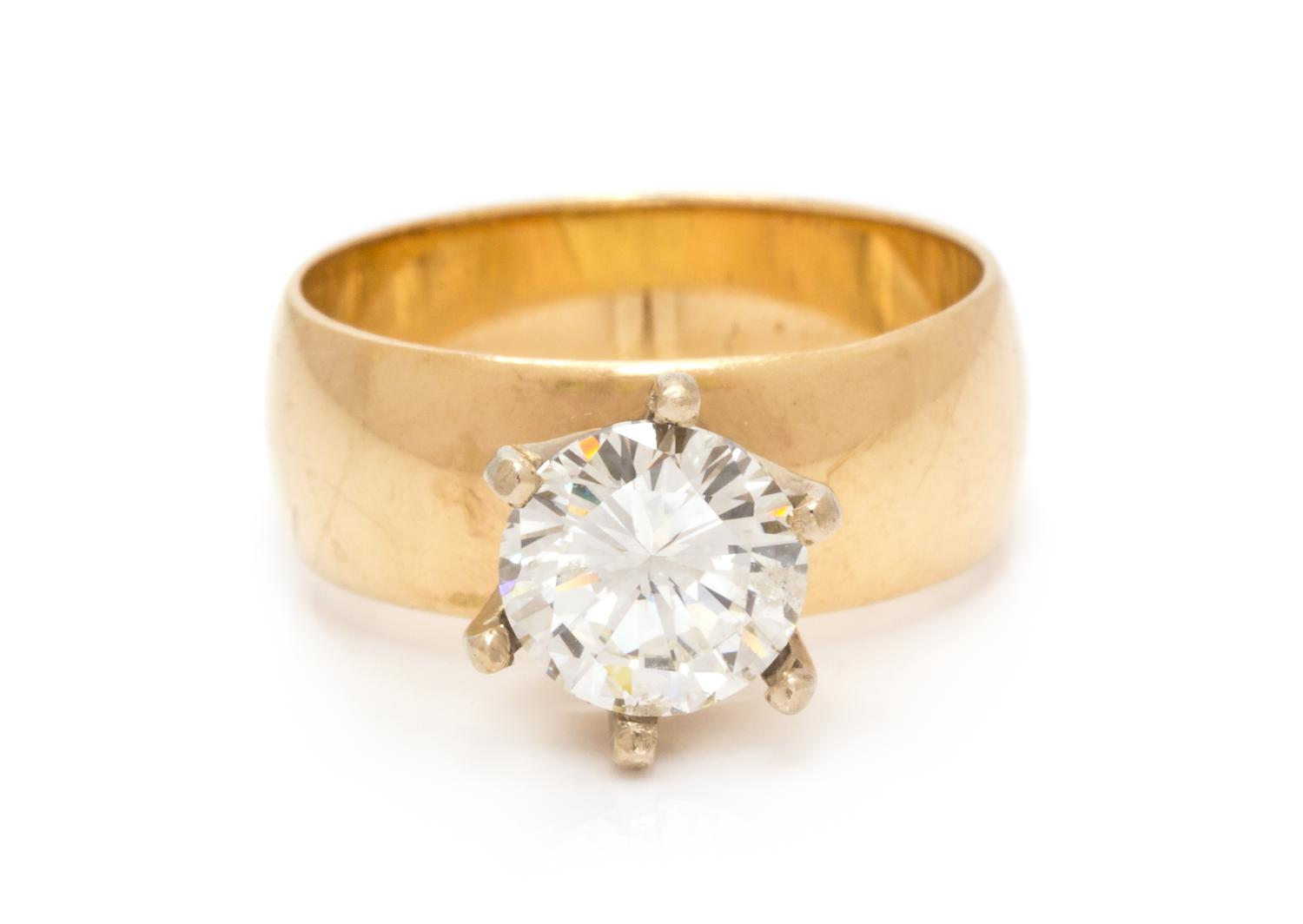 A 14 Karat Yellow Gold and Diamond Solitaire Ring, 4.20 dwts.
