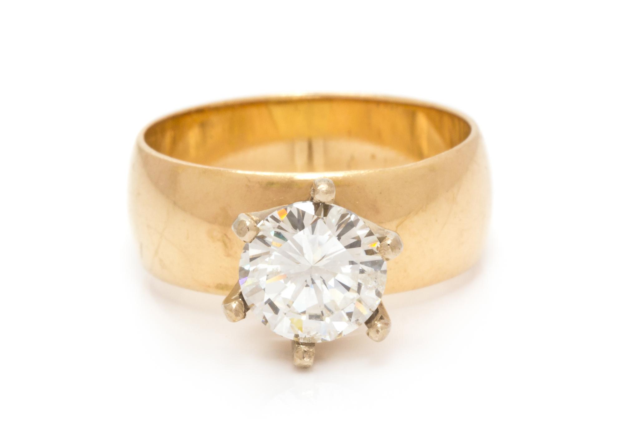 A 14 Karat Yellow Gold and Diamond Solitaire Ring, 4.20 dwts.