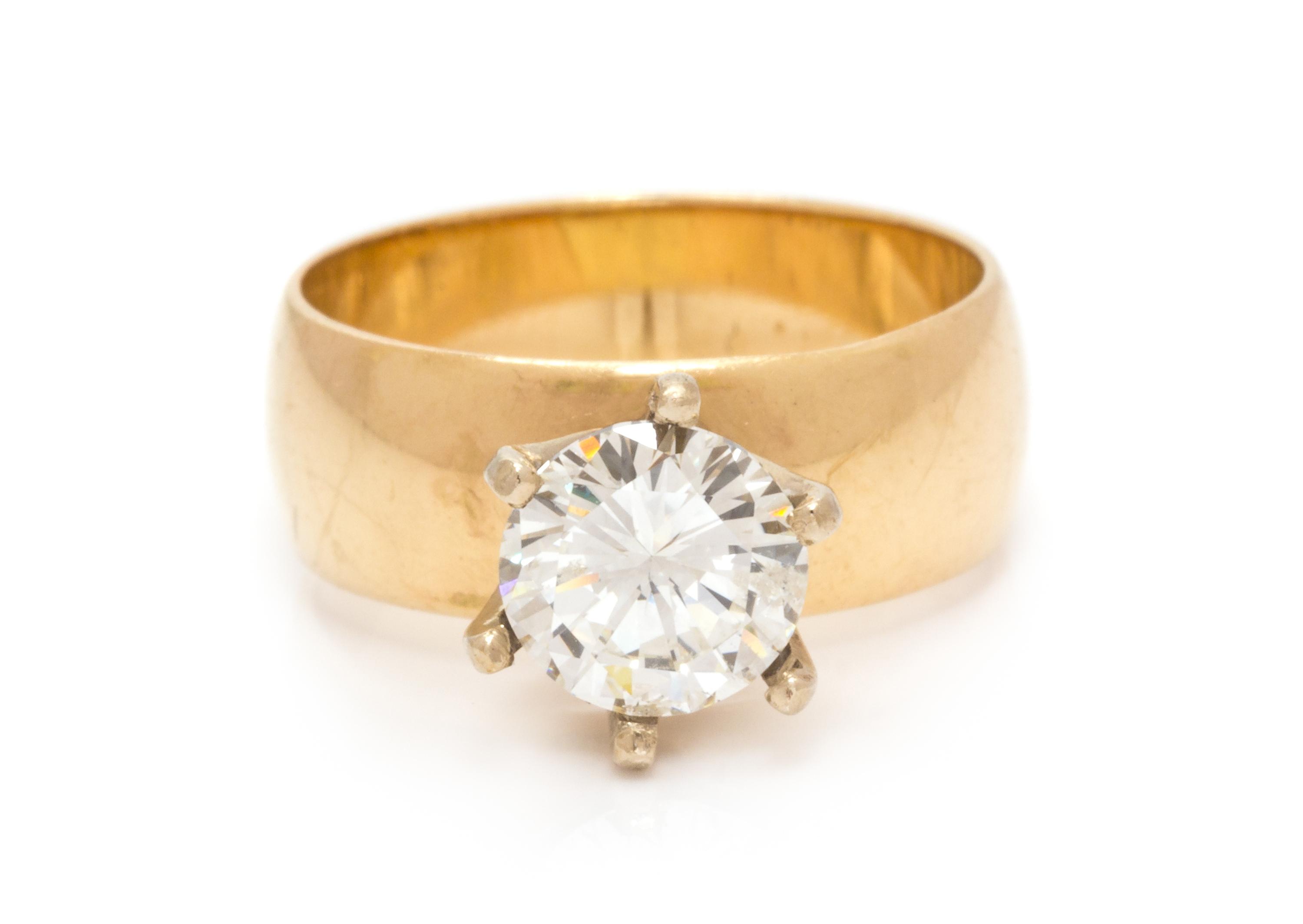 A 14 Karat Yellow Gold and Diamond Solitaire Ring, 4.20 dwts.