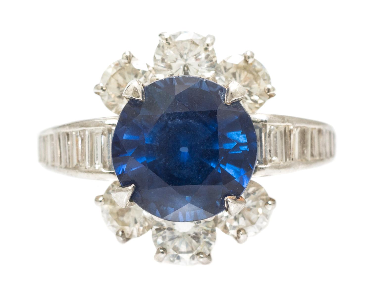 A Platinum, Yellow Gold, Sapphire and Diamond Ring, 6.40 dwts.