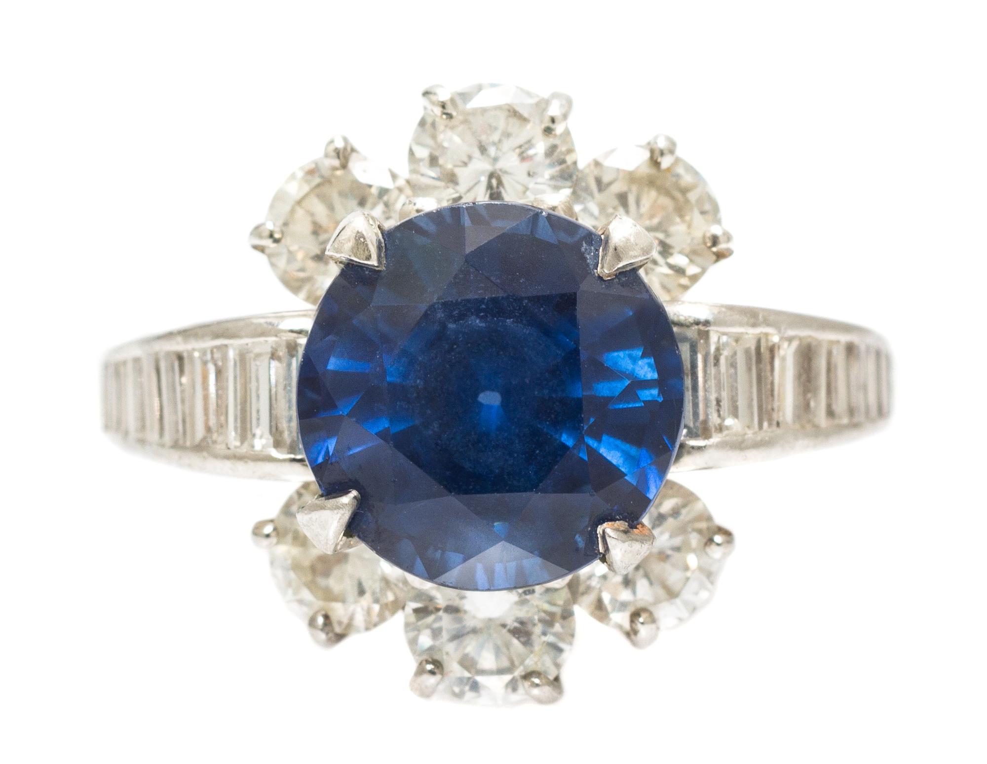A Platinum, Yellow Gold, Sapphire and Diamond Ring, 6.40 dwts.