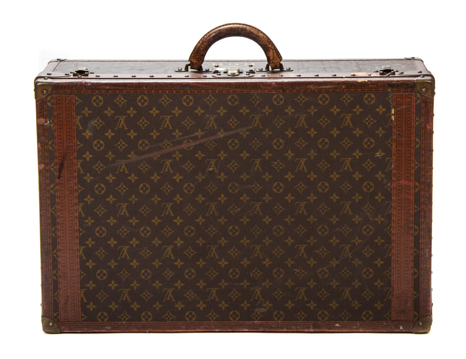A Louis Vuitton Monogram Canvas Hard-sided Suitcase, 27 1/2 x 18 x 8 inches.