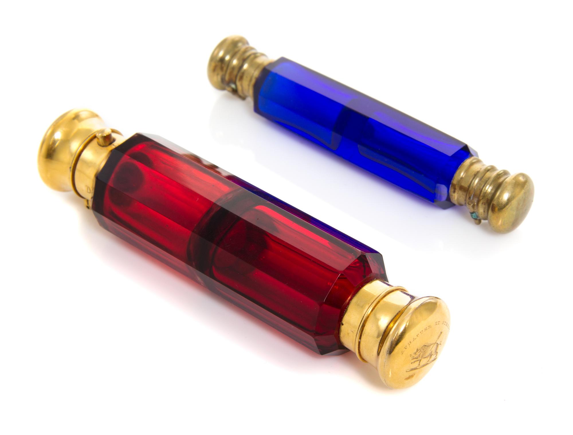 Two Double-Sided Gilt Metal Mounted Glass Scent Bottles, 19th Century, one in blue glass and one in red, the largest engraved on both s