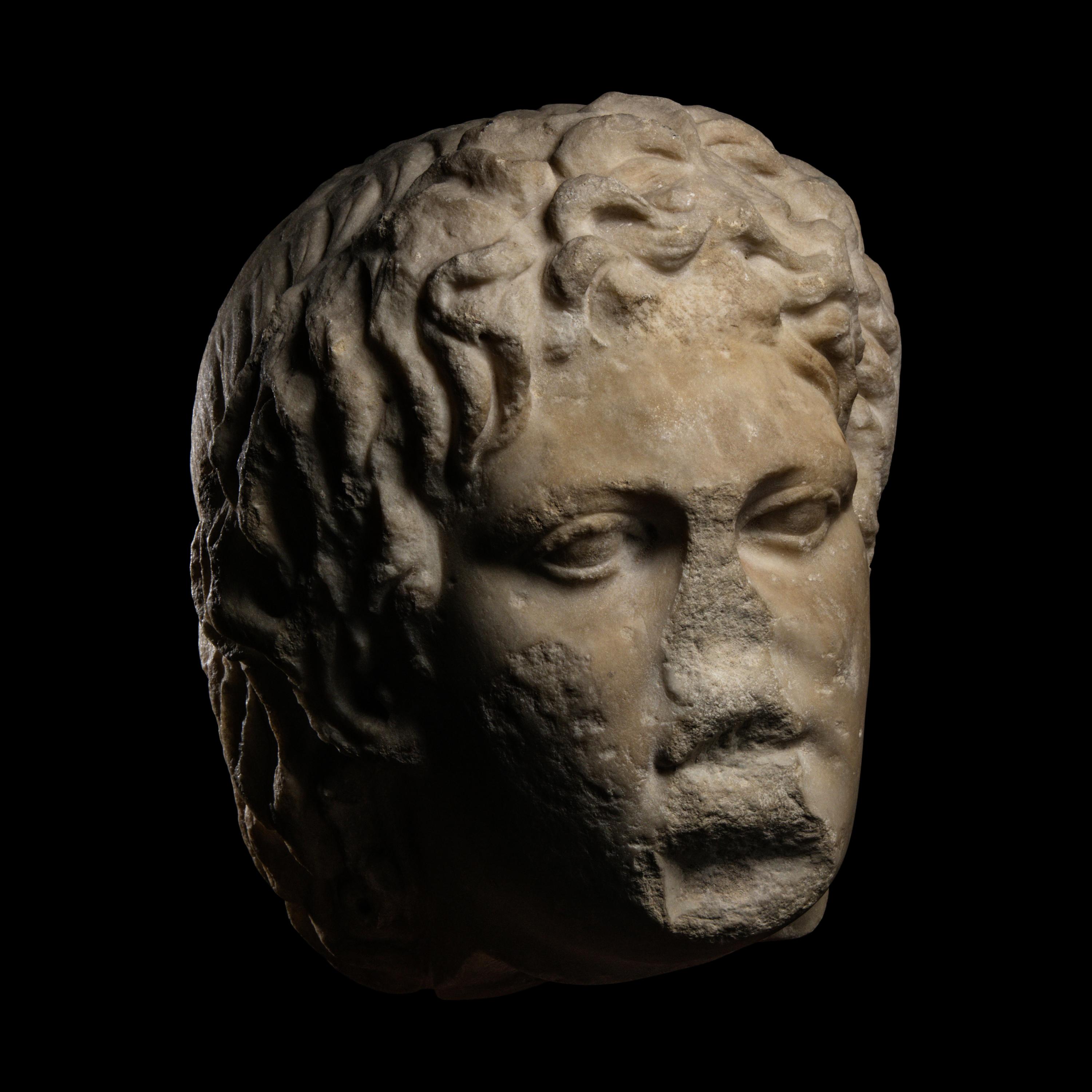A Roman Marble Head of a Satyr