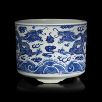 A Chinese Blue and White "Dragons" Tripod Porcelain Censer, Qing Dynasty — 清 青花云龍紋三足爐