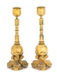 A Pair of Empire Gilt Metal Candlesticks Diameter of plaque 6 inches. — 19TH CENTURY