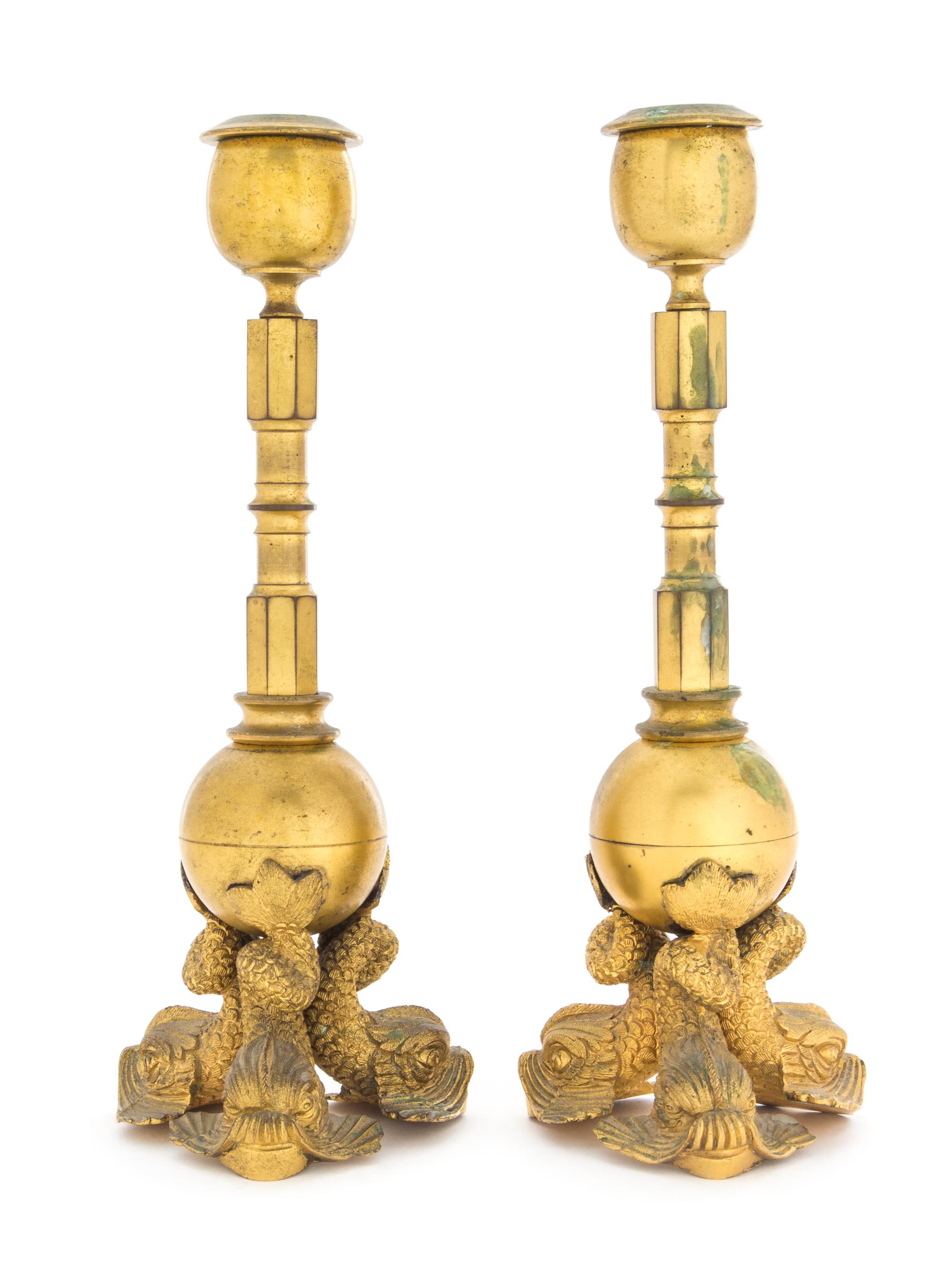 A Pair of Empire Gilt Metal Candlesticks Diameter of plaque 6 inches. — 19TH CENTURY