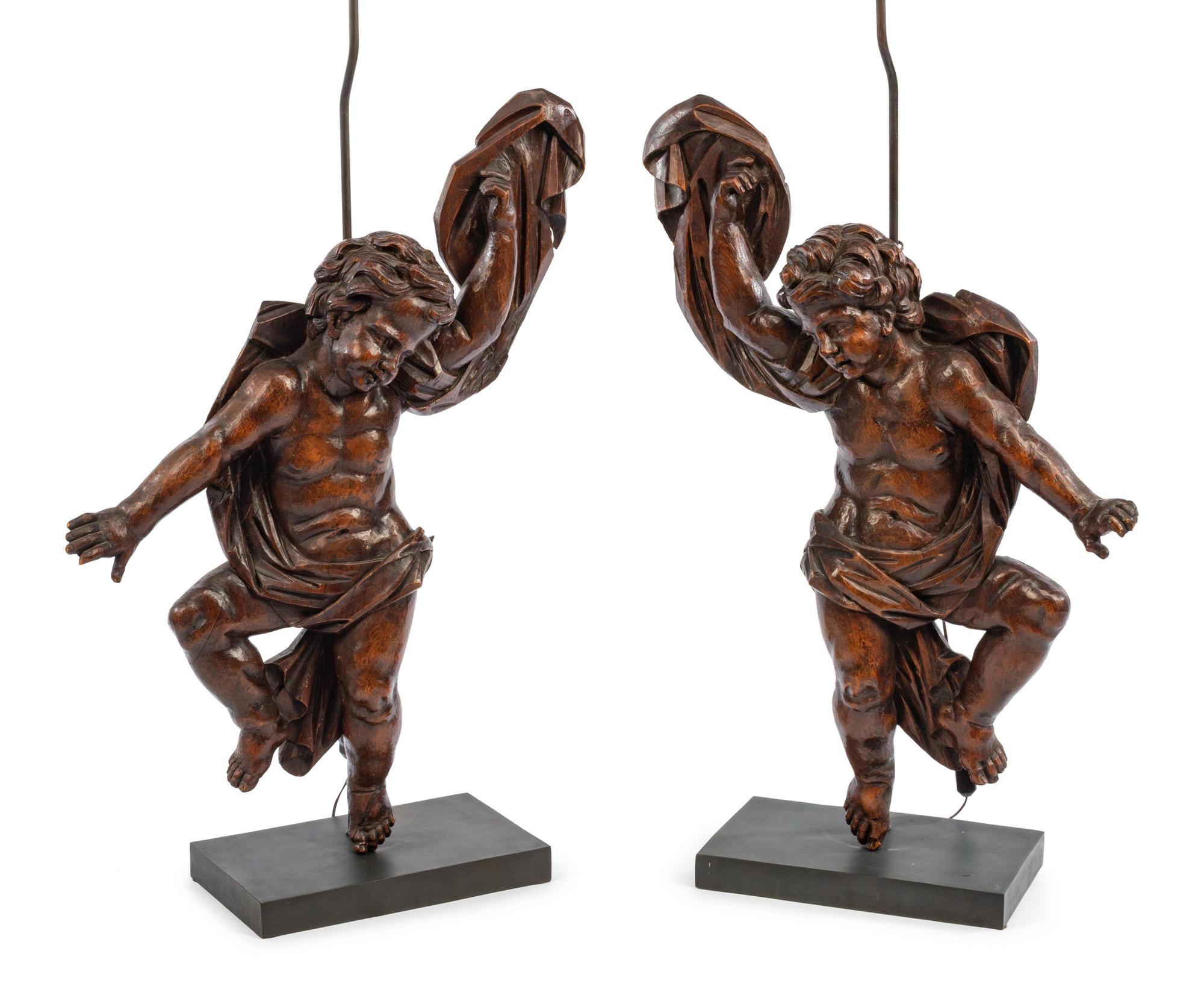 A Pair of Italian Carved Walnut Altar Figures Mounted as Lamps