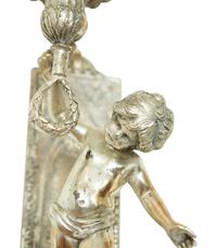 A Pair of Continental Silvered Metal Figural Wall Lights