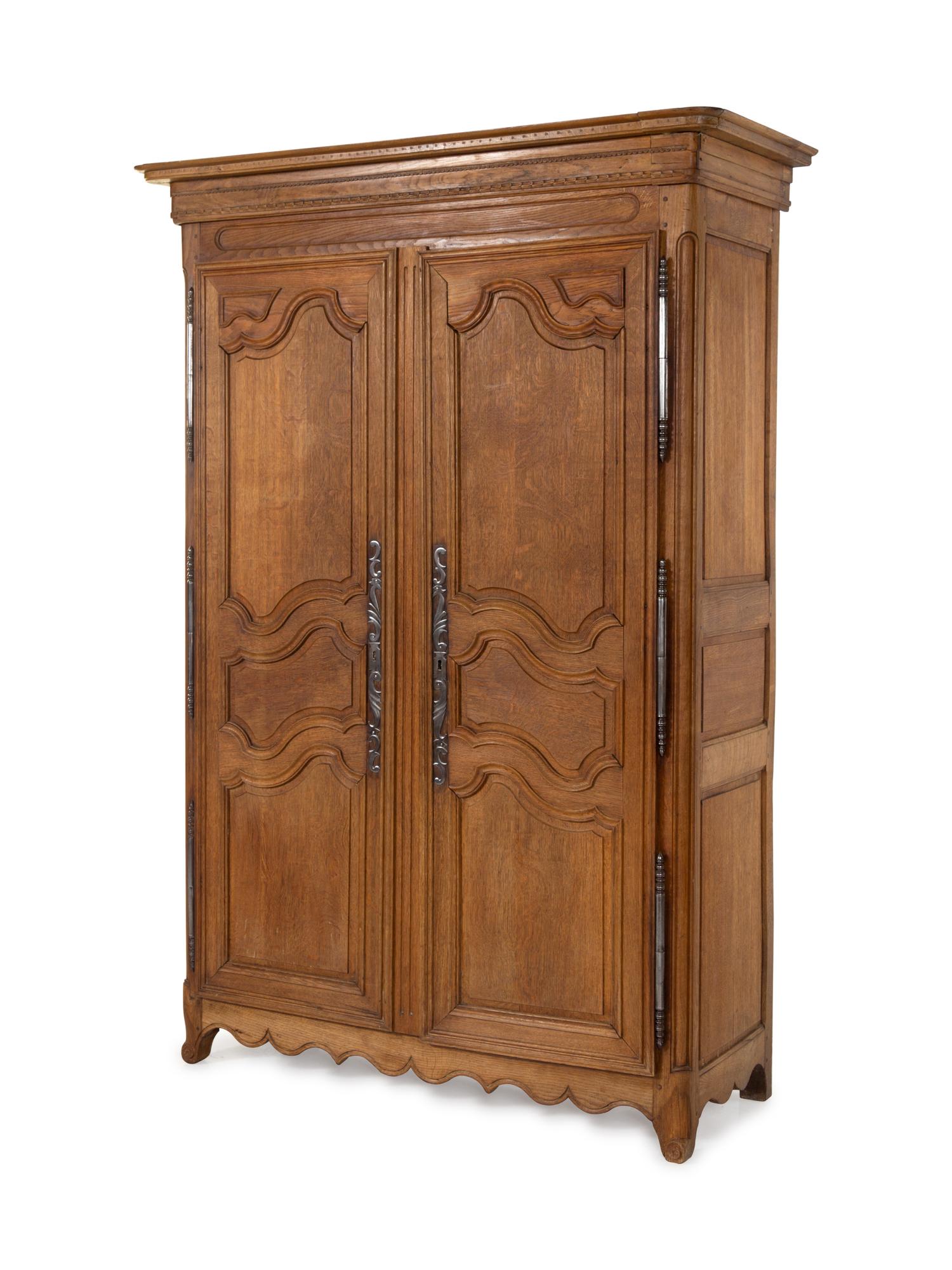A French Provincial Carved Oak Armoire