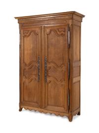 A French Provincial Carved Oak Armoire