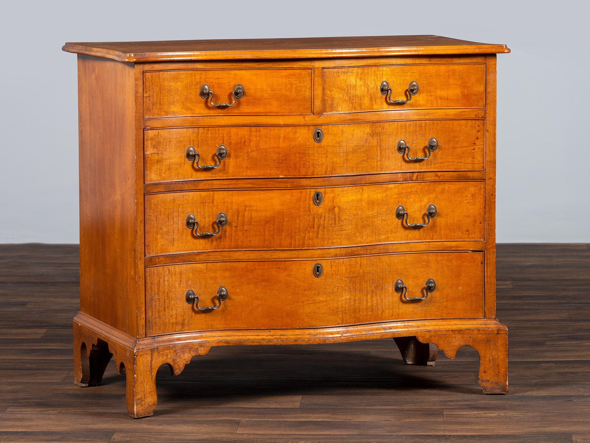 A Chippendale Style Tiger Maple Serpentine Chest of Drawers