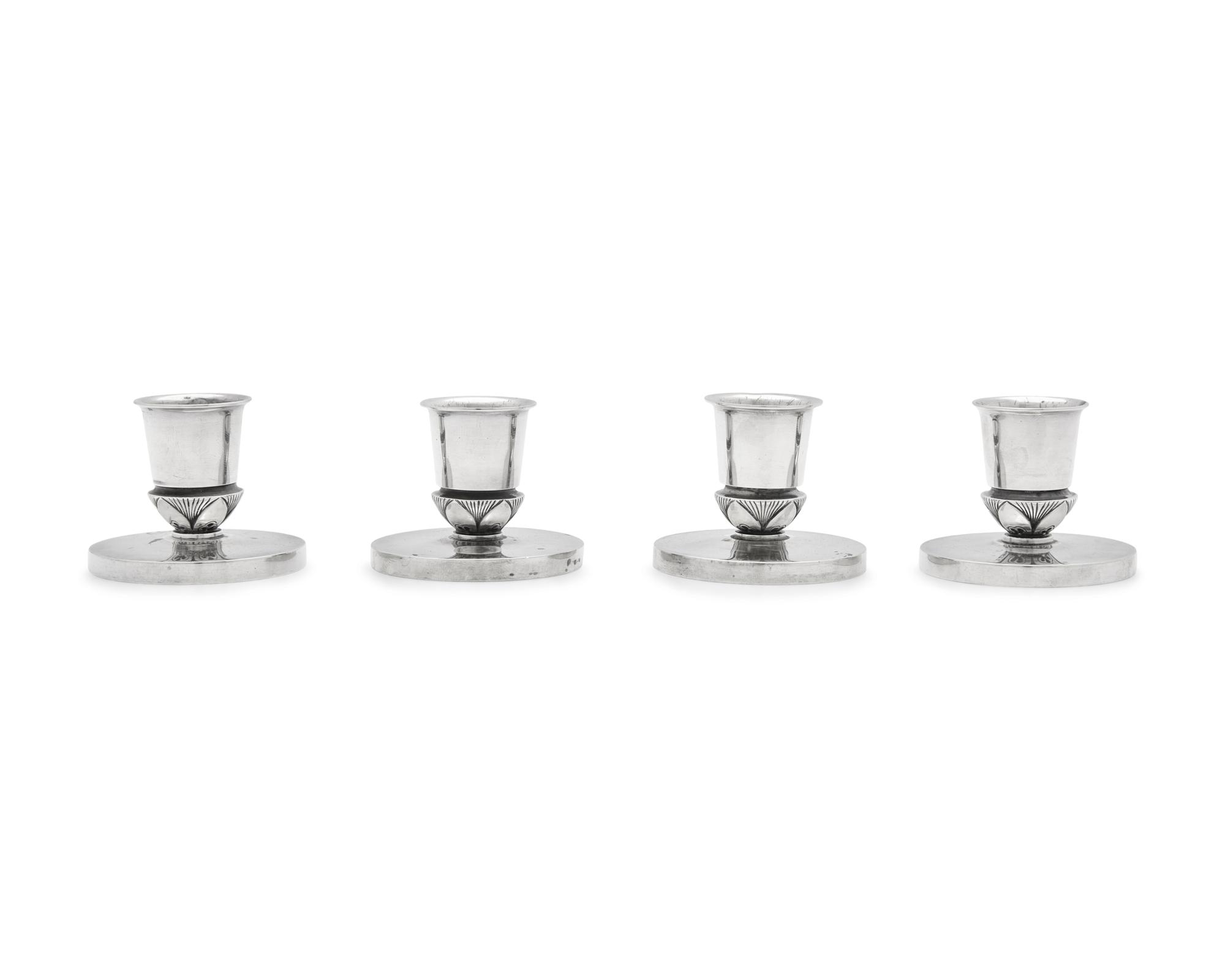 A Set of Four Gundorph Albertus Designed Georg Jensen Silver Cactus Pattern Candlesticks