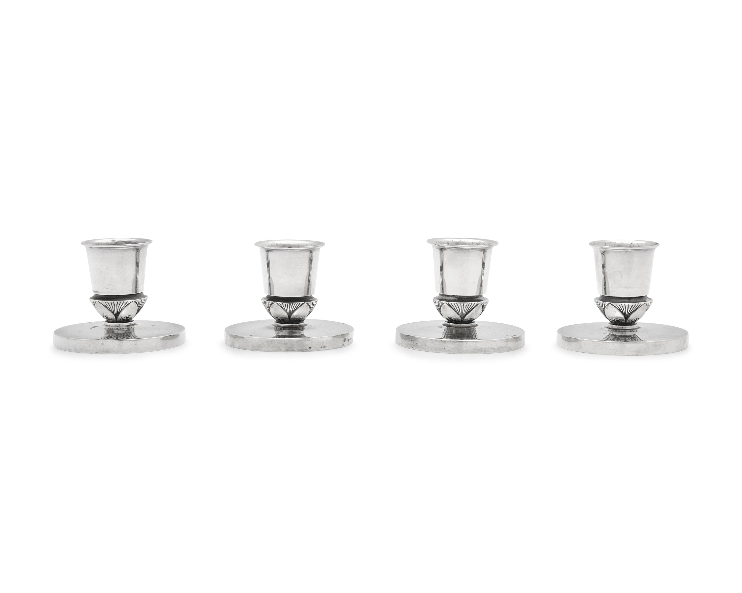 A Set of Four Gundorph Albertus Designed Georg Jensen Silver Cactus Pattern Candlesticks