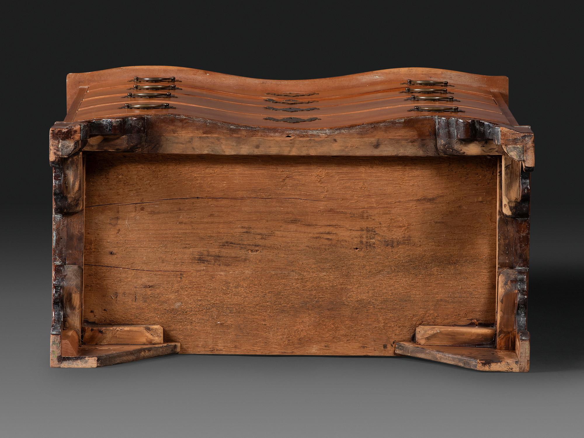 A Chippendale Cherrywood Reverse-Serpentine Chest of Drawers