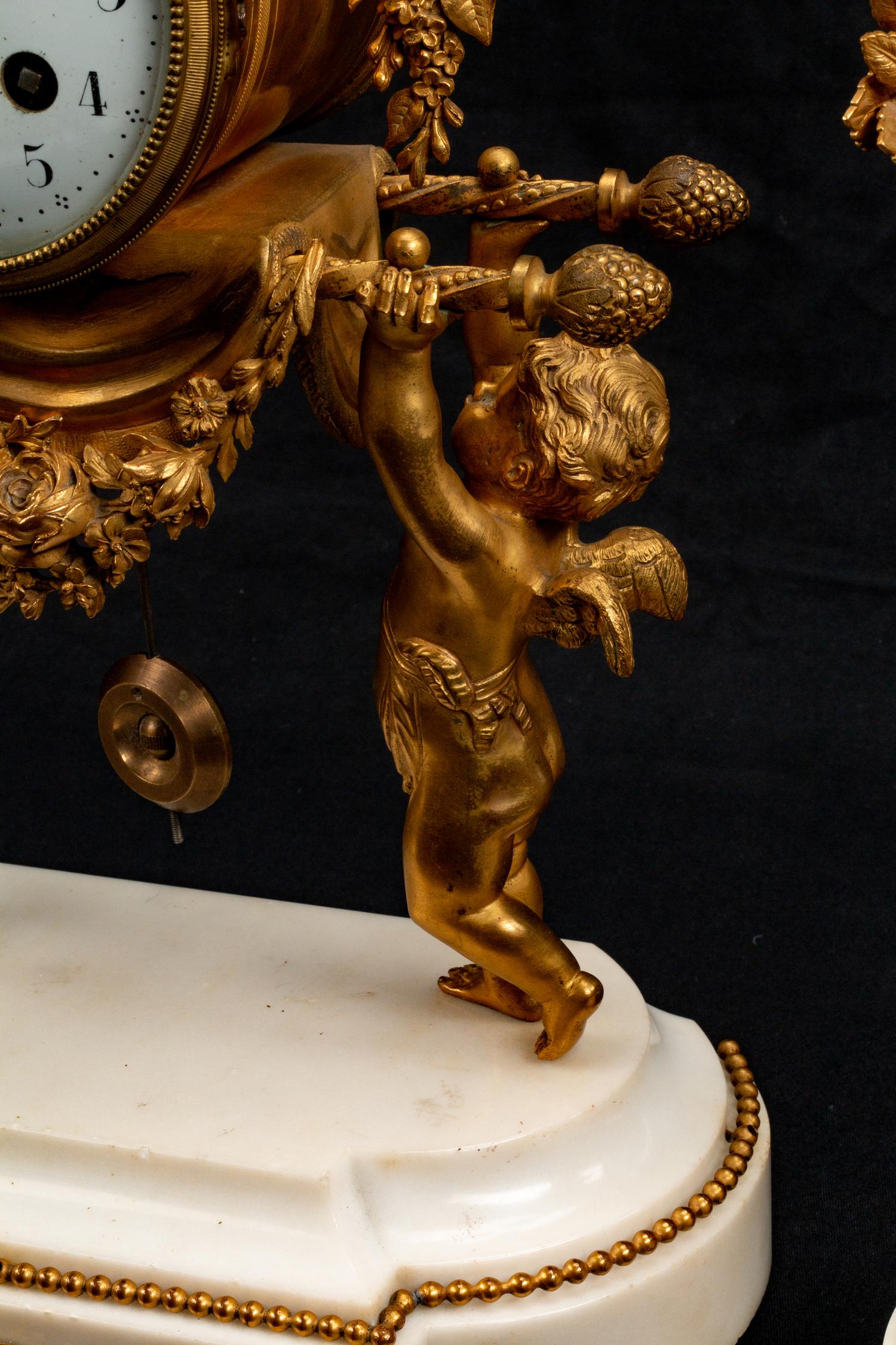 A Louis XVI Style Gilt-Bronze and Marble Three-Piece Clock Garniture — BAILLON, PARIS, LATE 19TH CENTURY